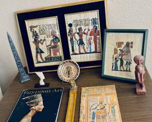 Egyptian Decor & Art Lot – Framed Papyrus Prints, Carved Stone Figurines, Books & Collectibles