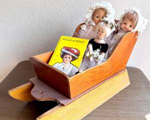 Trio Vintage Dolls in Wooden Sled Cradle + “Portrait of Dolls” Book Vignette