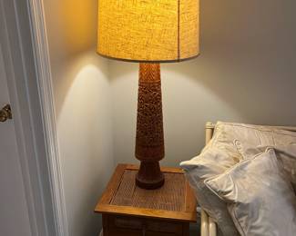 Tall carved lamps and tounge-and-groove made tables