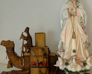 Vintage hand-carved camel cigarette holder and Our Lady of Fatima Statue