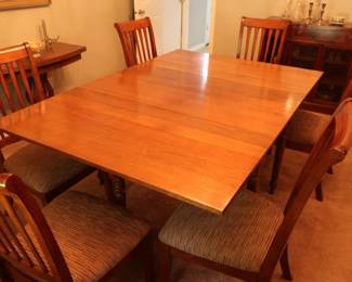 Dining room table and six chairs. There are 4 leaves. The table is 48" x 50" wide and the leaves are 13" each.
