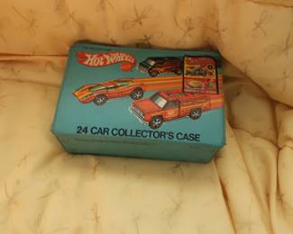 There are 5 Hot wheels and assorted other vintage toy cars  in  a  hot  wheels  case