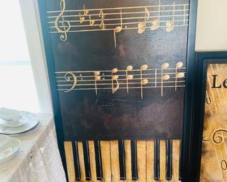 very large framed canvas that features music