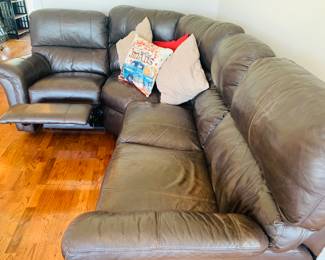 leather sectional sofa features foot rests on each end