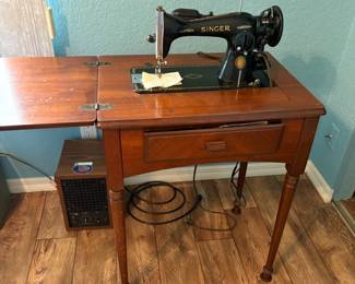 Singer Sewing Machine in cabinet Model #15. One of the 1st motor machines.  Centennial model, made 12/19/1949 in Lisbon New Jersey. In excellent condition.