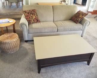 USA-made Broyhill couch in a neutral gray; mid-century coffee table. Covered basket