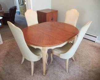 Dining set seats 4; two extra table leaves available