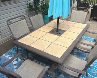 Iron and tile outdoor dining table with 6 chairs 