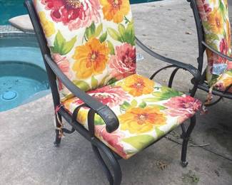 Wrought Iron outdoor dining chair with floral cushions
