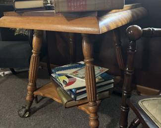 Square Clawfoot table with glass bottom, antique books