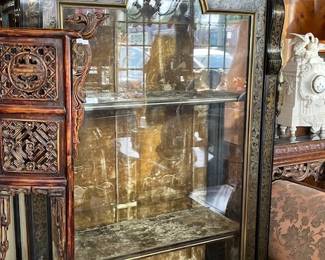 View of antique velvet interior of cabinets.