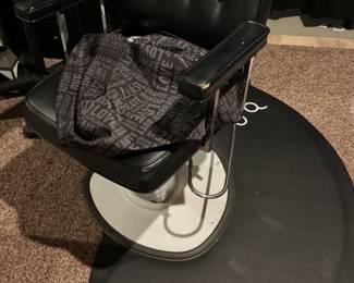 Professional hair salon chair with many other items