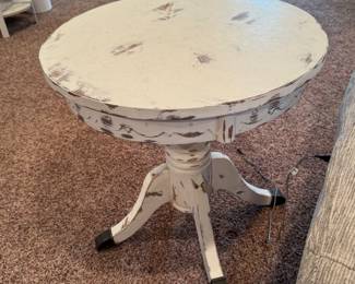 pair of white round tables