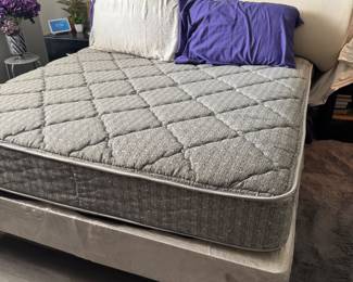 Queen Serta Chantilly Mattress that has had a protector on it