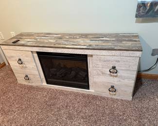 TV console/fire place unit that matches the prior set/ but sold separately