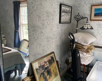 vintage art prints, vacuum, tiffany style floor lamp, bed linens