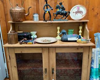 Pine side board $350, copper kettle $25, copper tea caddy $25, metal cowboy figures $25, carved ducks figures/decoys $10, copper burnished pottery plate $10