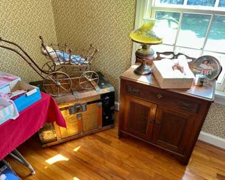 Walnut cupboard $100, oil lamp $25, vintage trunk $100, spindlework doll carriage $50, vintage doll $25