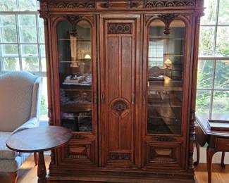 Walnut Bookcase, Maple Lampstand, Arm Chair.