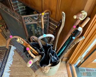 Stoneware crock $25, collection of vintage canes and umbrellas most $5-25