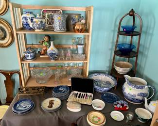 Various transferware and sponge decorated ceramics $25-50, stoneware crock $25, fruit fork and knife set $10, Crystal serving and drinkware most $10-50, Hummel figure of a boy $50