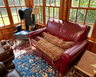 Red leather loveseat $100, leather wingback chair