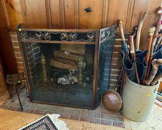 Fire screen $25, fireplace trivet $50, pair of andirons $50, stoneware crock $25, collection of vintage canes and umbrellas most $5-25