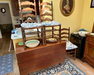 Drop leaf table $100, set of six ladder back chairs $100, oval framed portrait of a woman $50
