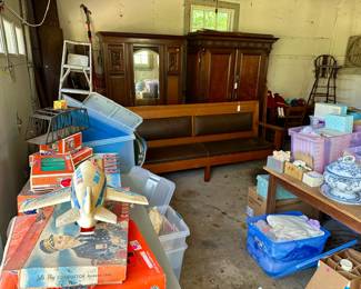 Garage items, including armoires, a bench, vintage toys and dolls, porcelain tableware