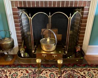 Brass fire screen $50, pair of andirons $50, Brass footstool $100, kettle $25, brass fender $50, porcelain figure of a cat $50