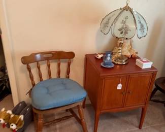 Small chair with cushion, small table with double doors and lamp. Cute bear slipper with voice