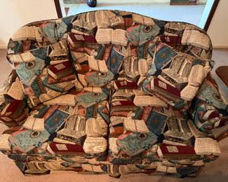 Traditional Love seat, material cover is assorted books and colors has matching sofa