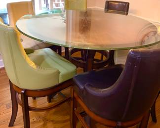 Nice kitchen table with glass on top of wood. Leather seats 
