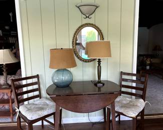 Side tables, wooden chairs, lamps, mirror