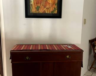 Three drawer wooden chest. Table runner. Painting