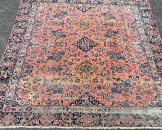 Room size wool antique Sarouk rug with age associated wear; 105” x 132”