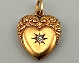 14kt gold Victorian repousse heart locket with star set diamond