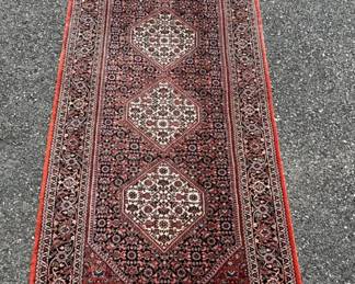 Wool Bidjar runner has rust red background; 32"W x 125”L