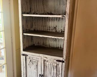 Whitewashed shelf unit 