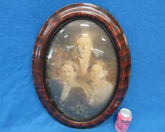 Lot 216. Convex glass picture frame with photo. 23" x 17"