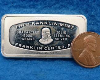 Lot 360. Franklin Mint Bank-marked sterling silver ingot. 65.38 grams