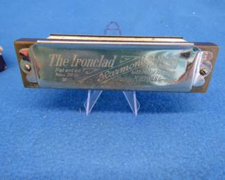 Lot 209. Hohner The Ironclad 10-hole octave harmonica in the key of G. Sounds great. The box is in poor condition.