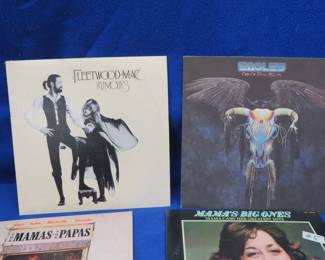 Lot 81. 12 LPs including Fleetwood Mac, The Eagles, The Mamas and the Papas, and more. The Ray Charles jacket is missing the record.