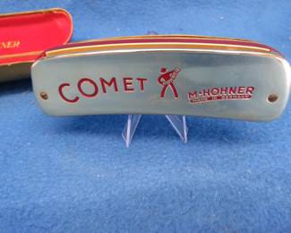 Lot 206. Hohner Comet 32-Hole Trema low harmonica and box, both in VGC.