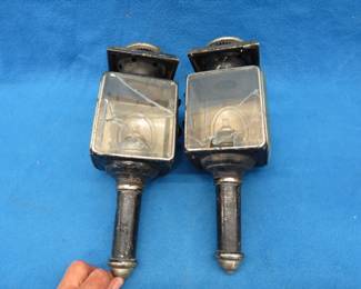 Lot 234. Pair of side lights from a carriage or an early auto. Clear glass needs replacing. Red bezels are both intact. No manufacturer's mark.