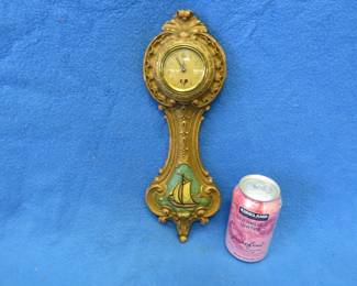 Lot 329. Lux wall clock with a sailboat motif. For parts or repair.