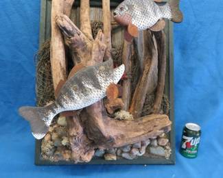 Lot 210. 19"W x 30"H x 17"D wall-mounted folk art fish and plant assemblage on wood. No shipping available