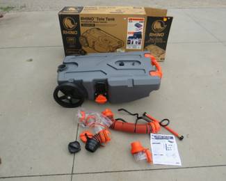 Lot 480. New-in-the-box 28-gallon Rhino portable RV waste tank. Includes all attachments and manual.