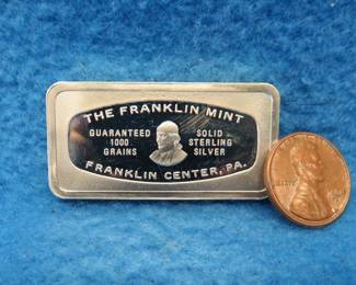Lot 354. Franklin Mint Bank-marked sterling silver ingot. 65.28 grams