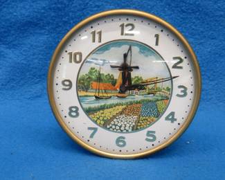 Lot 250. Working animated wind-up desk clock. Windmill arms turn. No maker's mark.